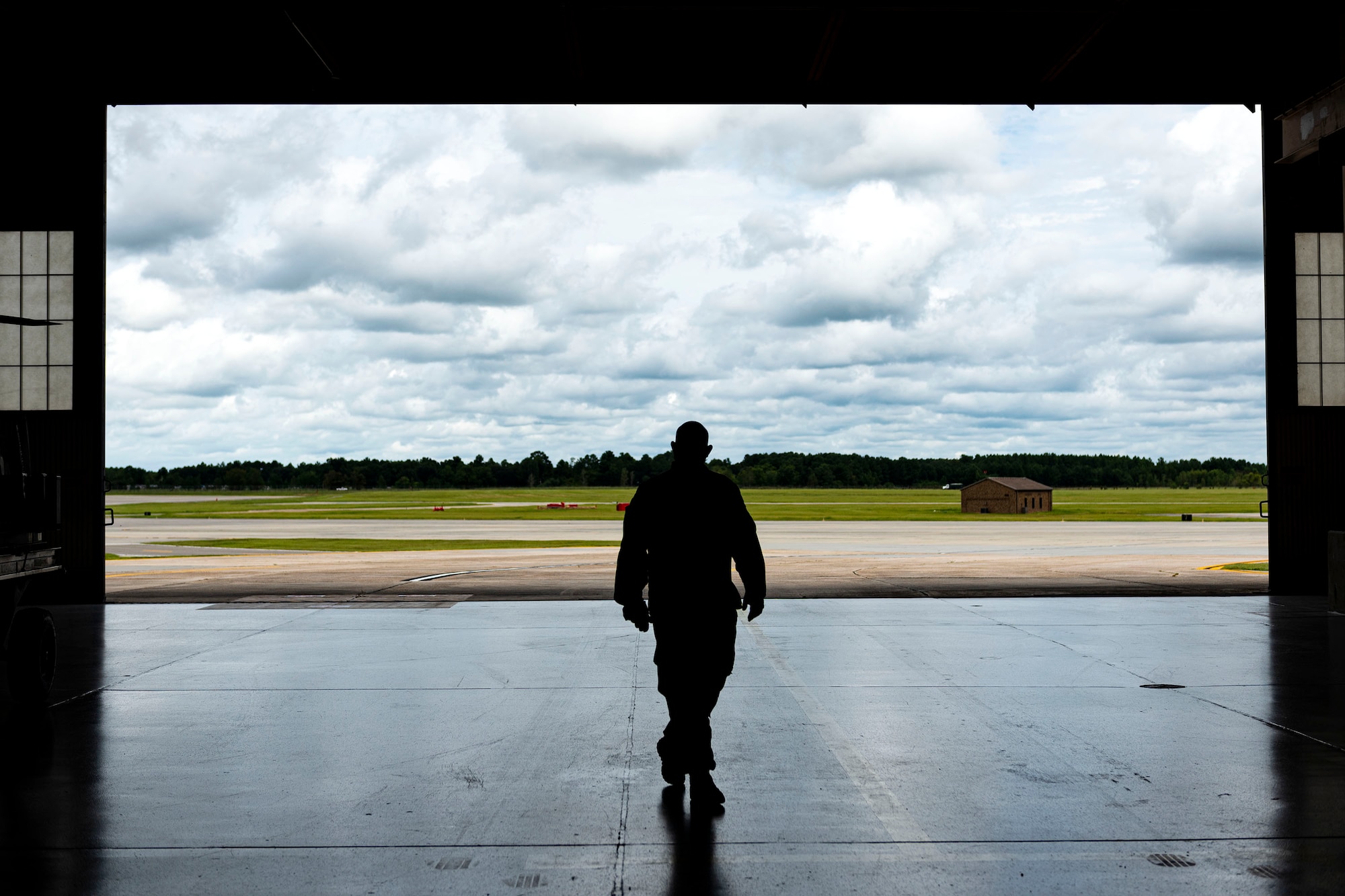 Photo of Airman walking toward a ceremony.
