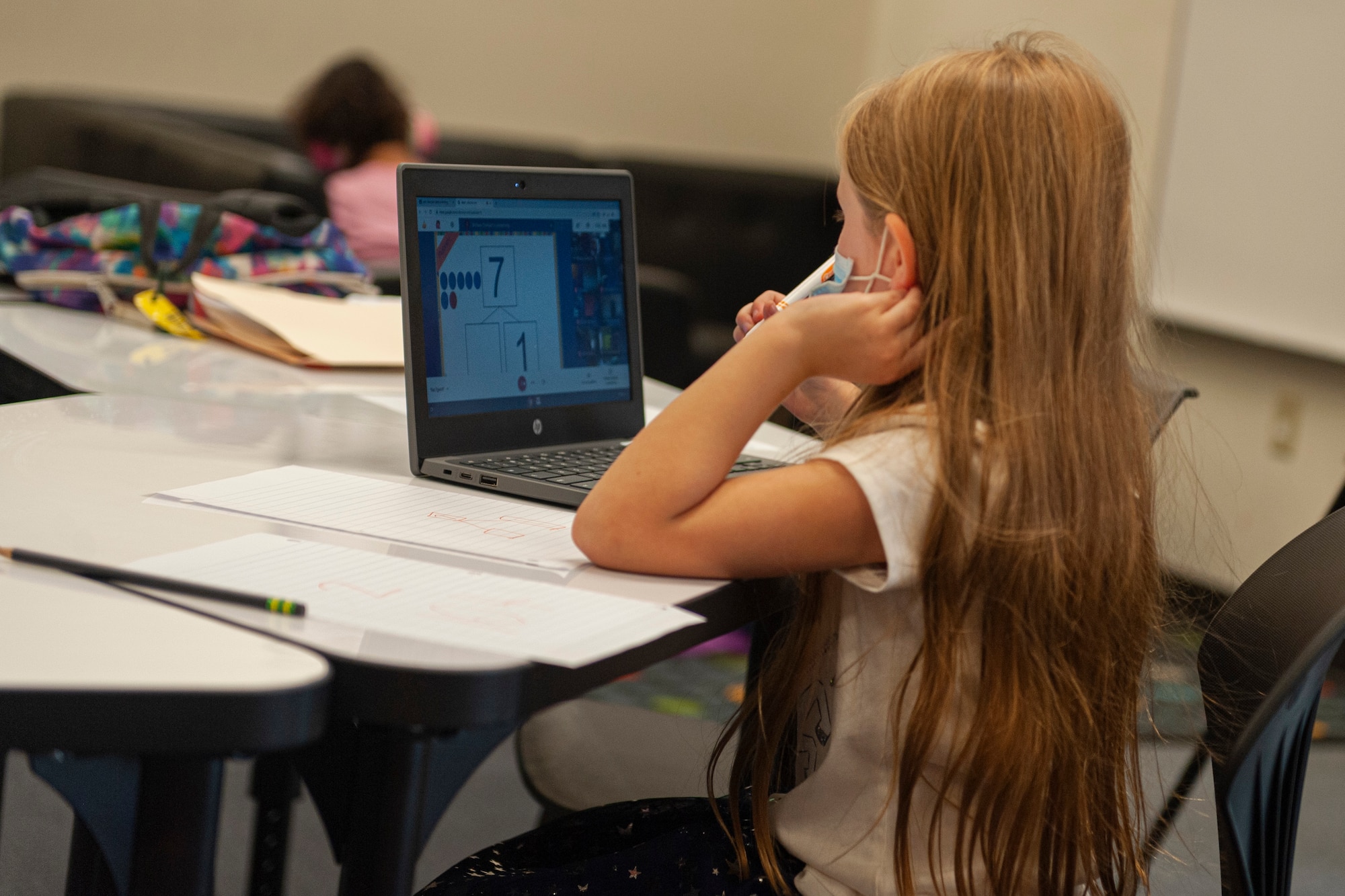Photo of a kid attending a virtual class