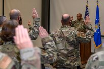 United States Air Force Chief of Staff Charles Q. Brown, Jr. administers the oath enlistment reaffirmation to recent basic military training graduates and Joint Base San Antonio-Lackland Airmen Aug. 21, 2020, at JBSA-Lackland, Texas