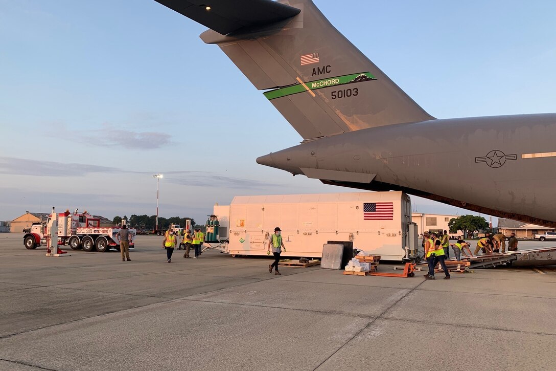 Airmen move a satellite.