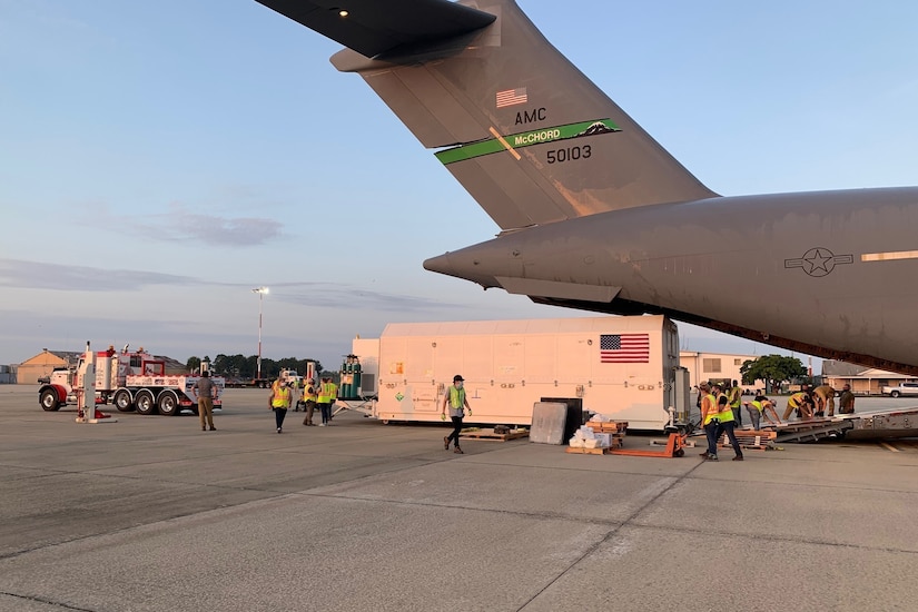 Airmen move a satellite.