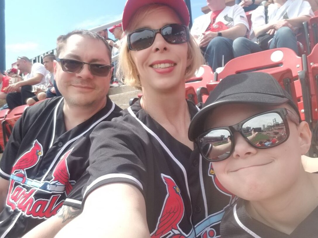 U.S. Air Force Chief Master Sgt. Casy Boomershine, 17th Training Wing command chief with her husband “Boomer” and her son, Magnus, watching a Cardinals baseball game at Busch Stadium. (Courtesy photo)