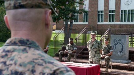 Fleet Master Chief Richard P. O'Rawe, assigned to U.S. Fleet Forces Command, speaks to U.S. Marines and Sailors stationed at Fleet Marine Force Atlantic, U.S. Marine Corps Forces Command during a Naval Integration Personnel Qualification Standard (PQS) Ceremony  onboard Naval Support Activity (NSA) Hampton Roads