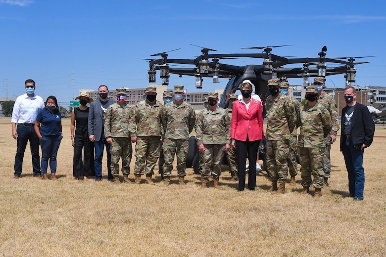Secretary of the Air Force Barbara Barrett, Chief of Staff of the Air Force Gen. Charles Q. Brown, Jr., and Chief Master Sgt. of the Air Force JoAnne S. Bass, AFWERX Total Force teammates and Maj. Gen. Tracy R. Norris, Adjutant General of the Texas National Guard, pose in front of the Agility Prime partner, LIFT Aircraft, after an ORB flight demonstration during a visit at Camp Mabry, Texas, Aug. 20, 2020. Agility Prime is a non-traditional program seeking to accelerate the commercial market for advanced air mobility vehicles. (Air National Guard photo by Staff. Sgt. Sean Kornegay)