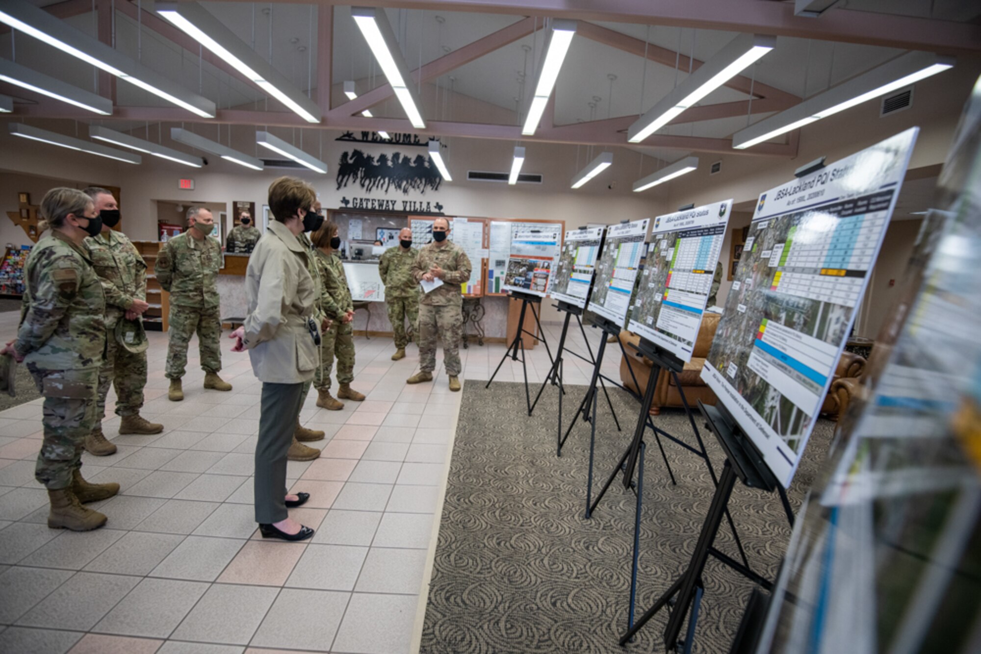 U.S. Air Force Lt. Col. Joseph Tortella (center), 902nd Civil Engineers Squadron commander, briefs Secretary of the Air Force Barbara M. Barrett, Chief of Staff of the Air Force Gen. Charles Q. Brown Jr., and Chief Master Sgt. of the Air Force JoAnne S. Bass about operations at Gateway Villa during a tour Aug. 21, 2020, at Joint Base San Antonio-Lackland, Texas.