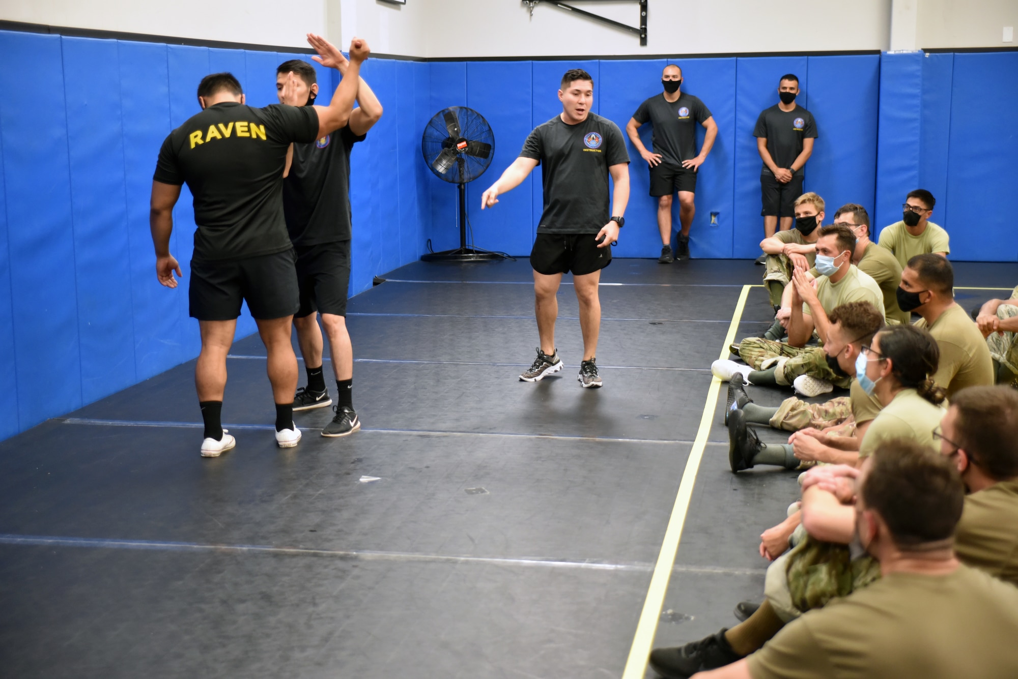 Phoenix Raven Qualification Instructors with the 421st Combat Training Squadron, demonstrate weapon defensive principles to the Phoenix Raven Qualification Course students in the U.S. Air Force Expeditionary Center’s Redman Room, Aug. 14, 2020, at Joint Base McGuire-Dix-Lakehurst, New Jersey. The course, which ran from July 27 to Aug, 19, qualifies selected security forces personnel to perform as members of a force protection team assigned to deploy with Department of Defense aircraft to austere environments. Students are trained to perform as teams to detect, deter, and counter threats to personnel/aircraft at deployed locations by performing close-in aircraft security and advising aircrew on force protection measures. In addition, the course prepares students to conduct/report airfield assessments and perform flight deck denial duties on select missions. (U.S. Air Force photo by Maj. George Tobias)