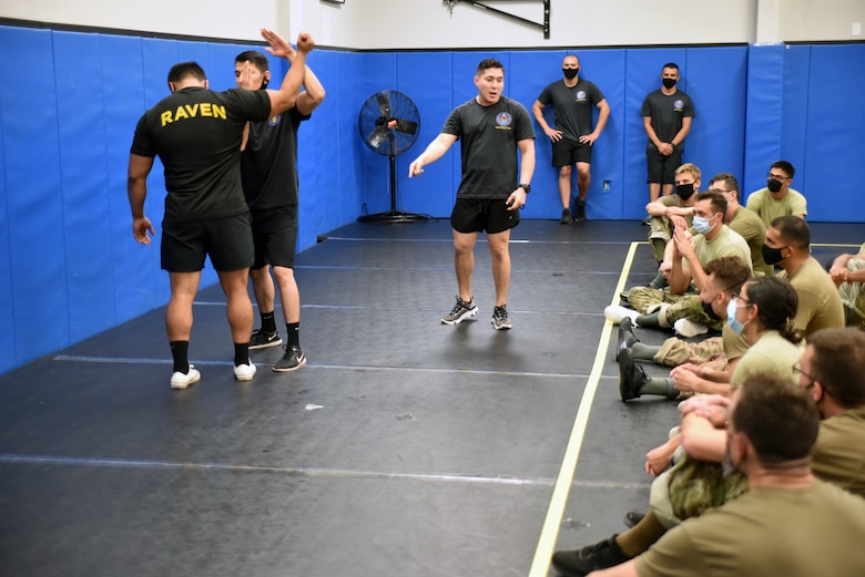 Phoenix Raven Qualification Instructors with the 421st Combat Training Squadron, demonstrate weapon defensive principles to the Phoenix Raven Qualification Course students in the U.S. Air Force Expeditionary Center's Redman Room, Aug. 14, 2020, at Joint Base McGuire-Dix-Lakehurst, New Jersey. The course, which ran from July 27 to Aug, 19, qualifies selected security forces personnel to perform as members of a force protection team assigned to deploy with Department of Defense aircraft to austere environments. Students are trained to perform as teams to detect, deter, and counter threats to personnel/aircraft at deployed locations by performing close-in aircraft security and advising aircrew on force protection measures. In addition, the course prepares students to conduct/report airfield assessments and perform flight deck denial duties on select missions. (U.S. Air Force photo by Maj. George Tobias)