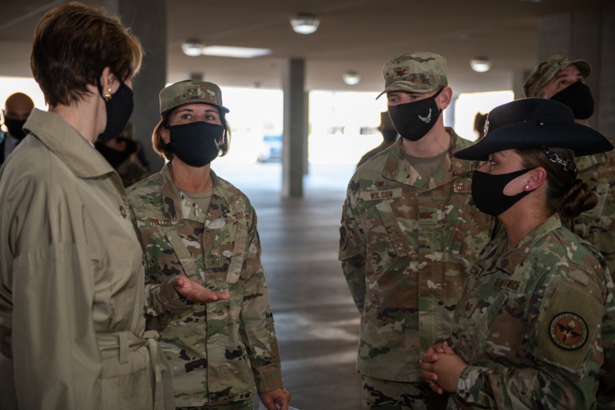 Secretary of the Air Force Barbara M. Barrett (left) listens as Maj. Gen. Andrea Tullos, 2nd Air Force commander, talks about basic military training during a tour of the Airman Training Complex Aug. 21, 2020, at Joint Base San Antonio-Lackland, Texas.
