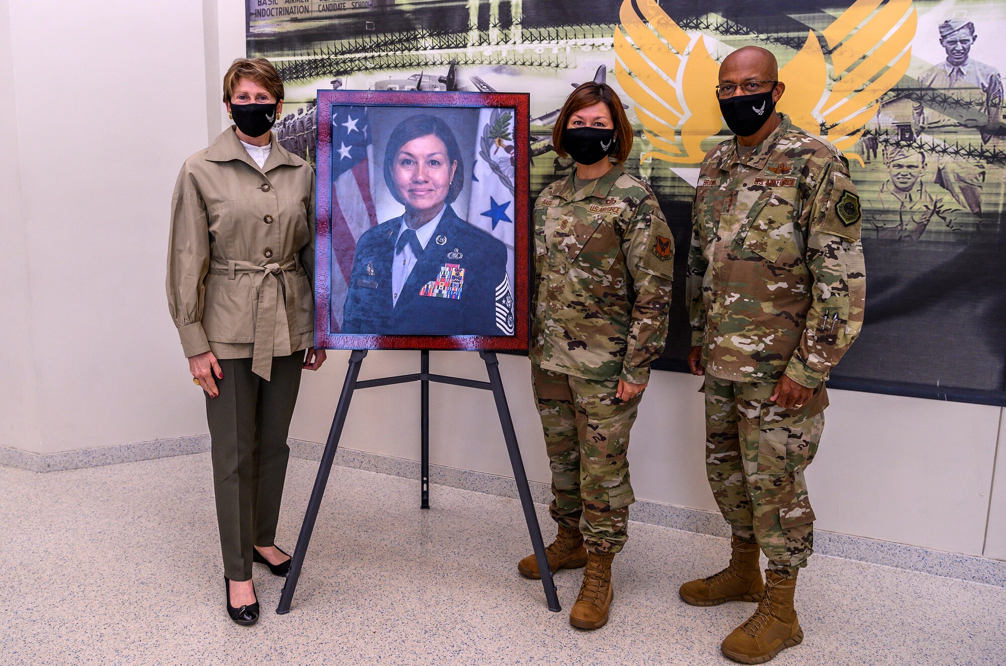 U.S. Secretary of the Air Force Barbara Barrett and Chief of Staff of the Air Force Gen. Charles Q. Brown, Jr. pose for a photo in front of Chief Master Sergeant of the Air Force JoAnne Bass's official portrait Aug. 21, 2020, at Joint Base San Antonio-Lackland, Texas.