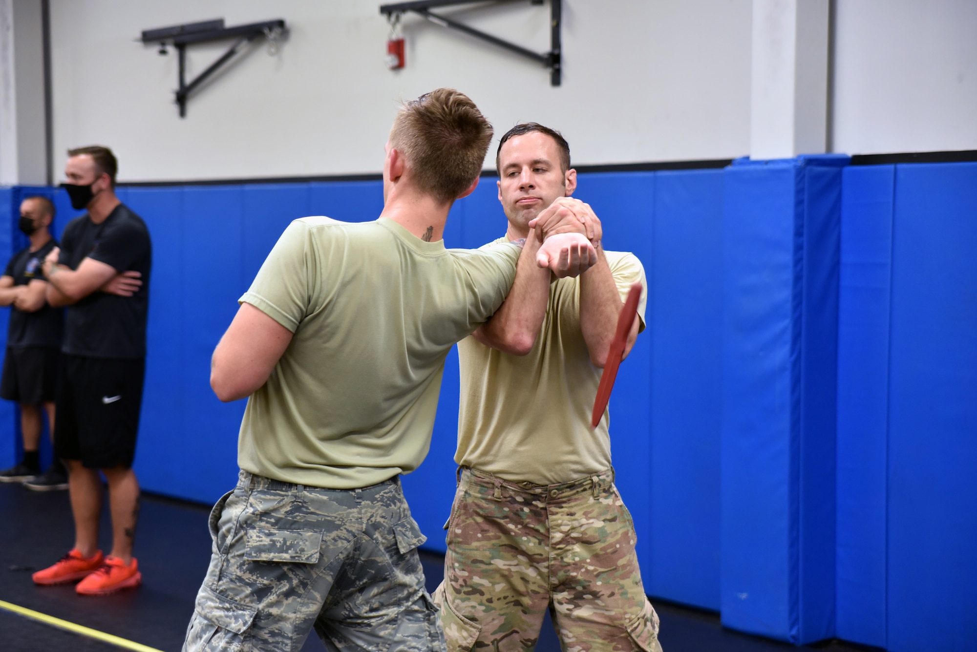 Tech. Sgt. Christopher Shultz, 60th Security Forces Squadron, disarms his training partner, Airman Jacob Walitzer, 19th Security Forces Squadron, during the Phoenix Rave Qualification Course at the U.S. Air Force Expeditionary Center, Aug. 14, 2020, at Joint Base McGuire-Dix-Lakehurst, New Jersey. The course, which ran from July 27 to Aug, 19, qualifies selected security forces personnel to perform as members of a force protection team assigned to deploy with Department of Defense aircraft to austere environments. Students are trained to perform as teams to detect, deter, and counter threats to personnel/aircraft at deployed locations by performing close-in aircraft security and advising aircrew on force protection measures. In addition, the course prepares students to conduct/report airfield assessments and perform flight deck denial duties on select missions. (U.S. Air Force photo by Maj. George Tobias)