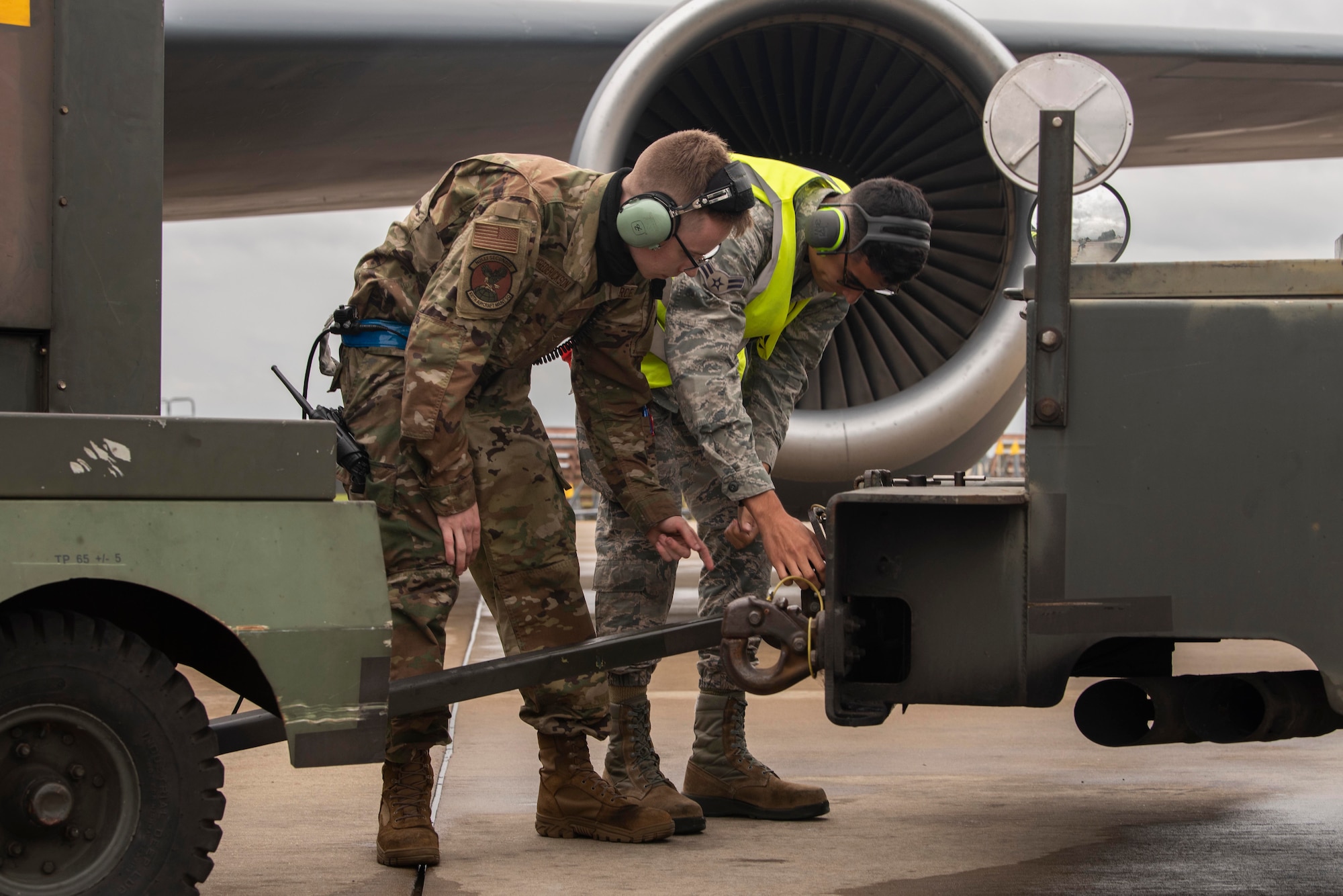 Airman Drake Koenig-Frederickson, 100th Aircraft Maintenance Squadron aerospace propulsion journeyman, left, and Airman 1st Class Nahyan Rivera-Wong, 100th AMXS aerospace propulsion apprentice, connect a generator to a dispatch vehicle in preparation for the launch of a KC-135 Stratotanker aircraft at Royal Air Force Mildenhall, England, Aug. 19, 2020. The 100th Air Refueling Wing conducts air refueling and combat support operations throughout the European and African area of responsibility. (U.S. Air Force photo by Airman 1st Class Joseph Barron)