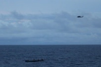 An MH-60R “Seahawk” assigned to Helicopter Maritime Strike Squadron 60 (HSM 60) embarked onboard the Arleigh Burke-class guided-missile destroyer USS Nitze (DDG 94) with embarked U.S. Coast Guard (USCG) Law Enforcement Detachment (LEDET) team conducts enhanced counter narcotics operations Aug. 4, 2020. Nitze and embarked LEDET recovered 725 kilograms of suspected cocaine and 3,190 pounds of suspected marijuana. Nitze is deployed to the U.S. Southern Command area of responsibility to support counter illicit drug trafficking in the Caribbean and Eastern Pacific. (U.S. Navy Photo by Gunners Mate 3rd Class Jessica Telfer/Released)