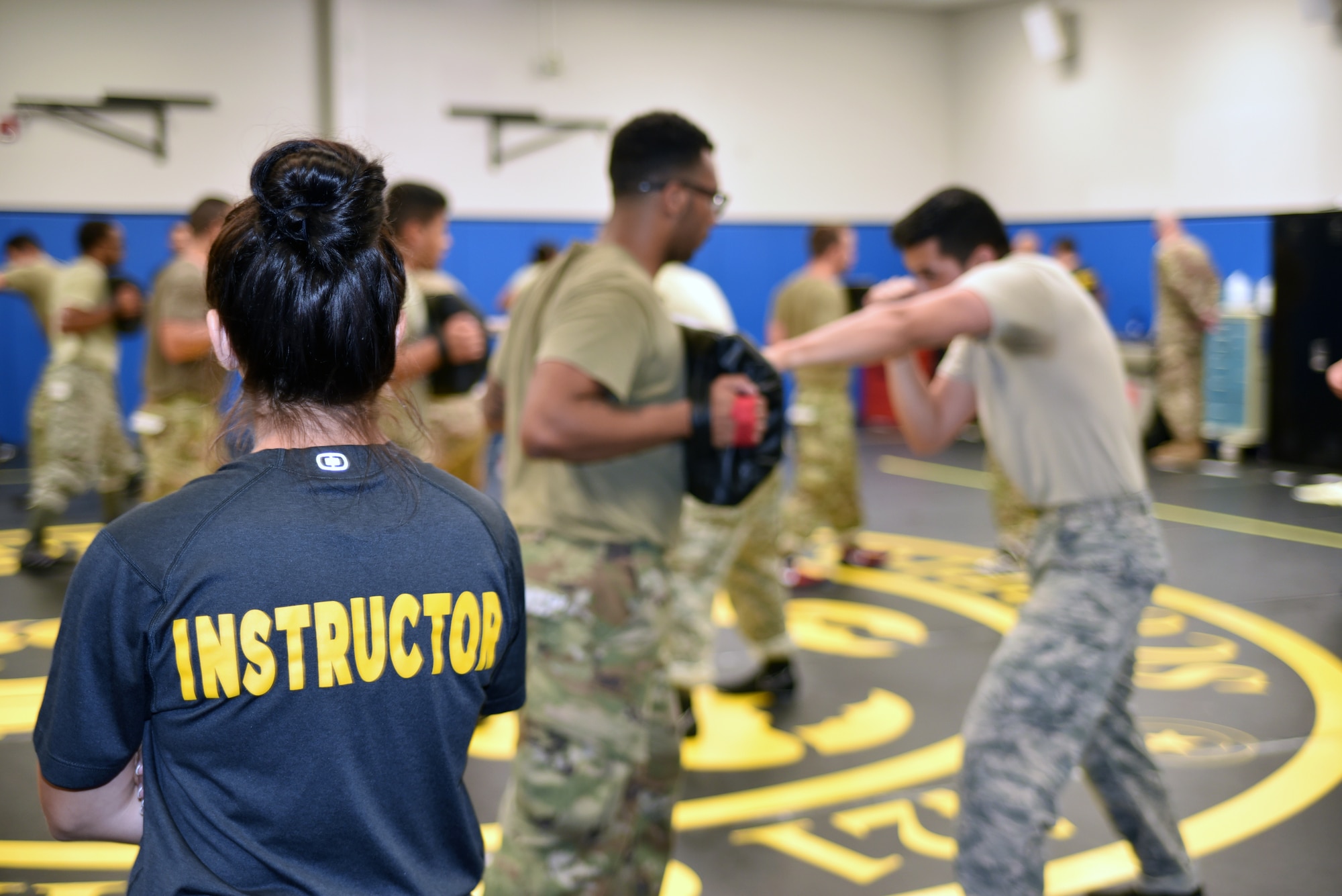 Staff Sgt. Melida Diaz, Phoenix Raven Qualification Instructor, 421st Combat Training Squadron, observes the form of the Phoenix Raven Qualification Course students as they practice strikes with their partners in the U.S. Air Force Expeditionary Center’s Redman Room, Aug. 12, 2020, at Joint Base McGuire-Dix-Lakehurst, New Jersey. The course, which ran from July 27 to Aug, 19, qualifies selected security forces personnel to perform as members of a force protection team assigned to deploy with Department of Defense aircraft to austere environments. Students are trained to perform as teams to detect, deter, and counter threats to personnel/aircraft at deployed locations by performing close-in aircraft security and advising aircrew on force protection measures. In addition, the course prepares students to conduct/report airfield assessments and perform flight deck denial duties on select missions. (U.S. Air Force photo by Maj. George Tobias)