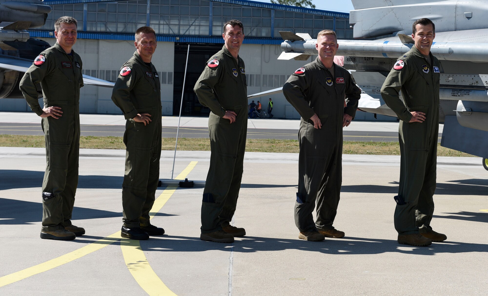 Starting far left, Polish Air Force Col. Tomasz Jatczak, 32nd Tactical Air Base commander, Brig. Gen. Iteneusz Nowak, 2nd Tactical Air Wing commander, U.S. Air Force Col. David Epperson, 52nd Fighter Wing commander, Lt. Col. Patrick Kennedy, 480th Expeditionary Fighter Squadron commander, and Lt. Col. Albert Roper, 52nd Operations Group Detachment One commander, stand in front of a static display for brief interviews at Łask AB, Poland, August 21, 2020. During Aviation Detachment Rotation 20.4, the Polish and U.S. forces will be flying, training and learning together as they work to foster regional security and prosperity. (U.S. Air Force photo by Senior Airman Melody W. Howley)