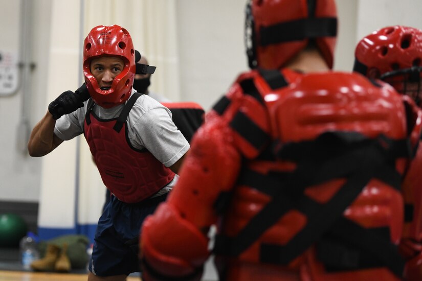 Senior Airman Ahmad Richardson, Fly-Away Security Team training participant, fights the Redman, a simulated aggressor, during the “Pre-Raven” course at Joint Base Andrews, Md., Aug. 14, 2020.