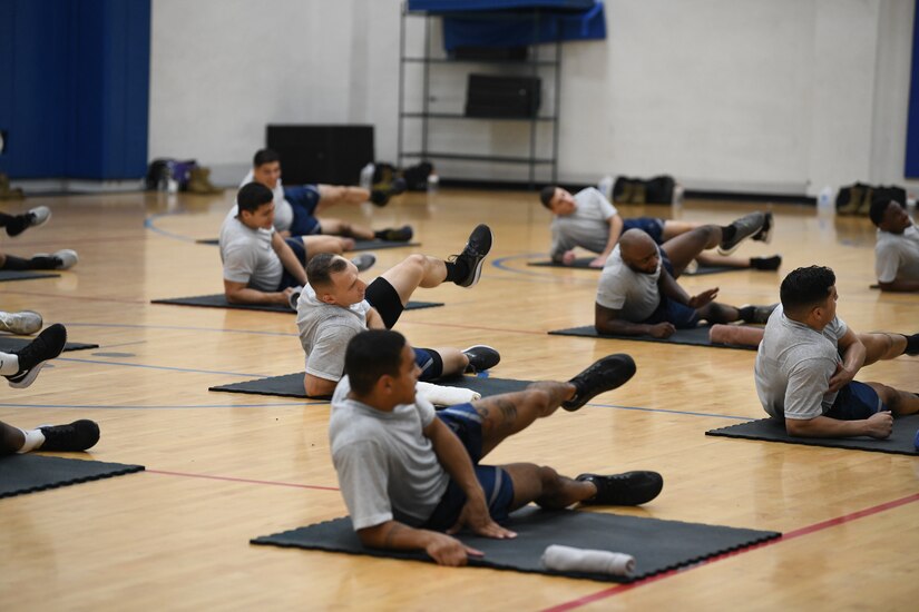 Airmen perform warm-up exercises during the Fly-Away Security Team training course, nicknamed “Pre-Raven,” at Joint Base Andrews, Md., Aug. 14, 2020.