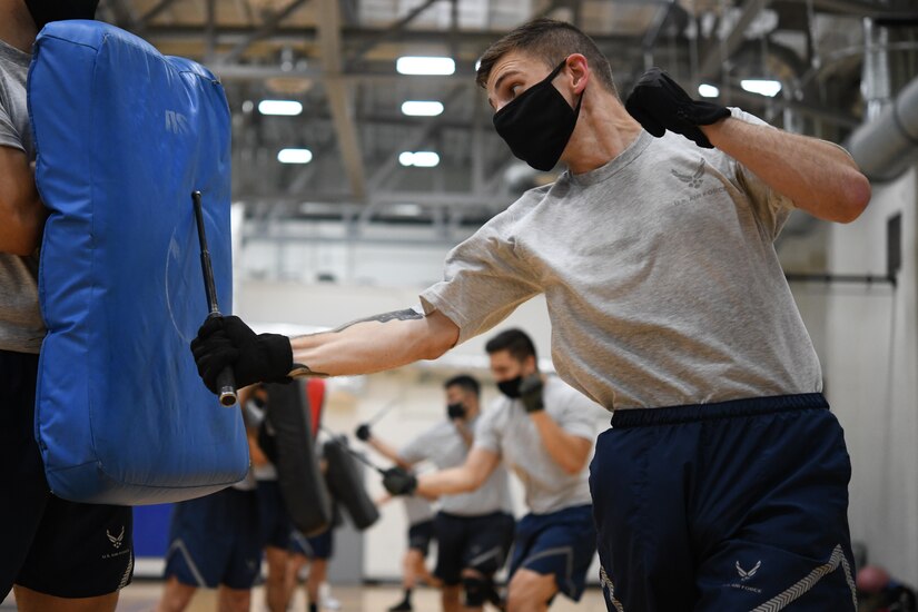 Senior Airman Michael Riley performs a baton maneuver during the Fly-Away Security Team training course, nicknamed “Pre-Raven,” at Joint Base Andrews, Md., Aug. 14, 2020.