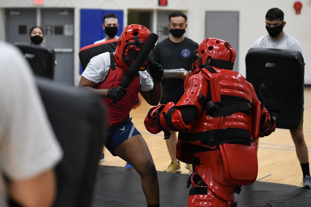 Staff Sgt. Simone Stephens, Fly-Away Security Team training participant, fights the Redman, a simulated aggressor, during the training course, nicknamed “Pre-Raven,” at Joint Base Andrews, Md.,