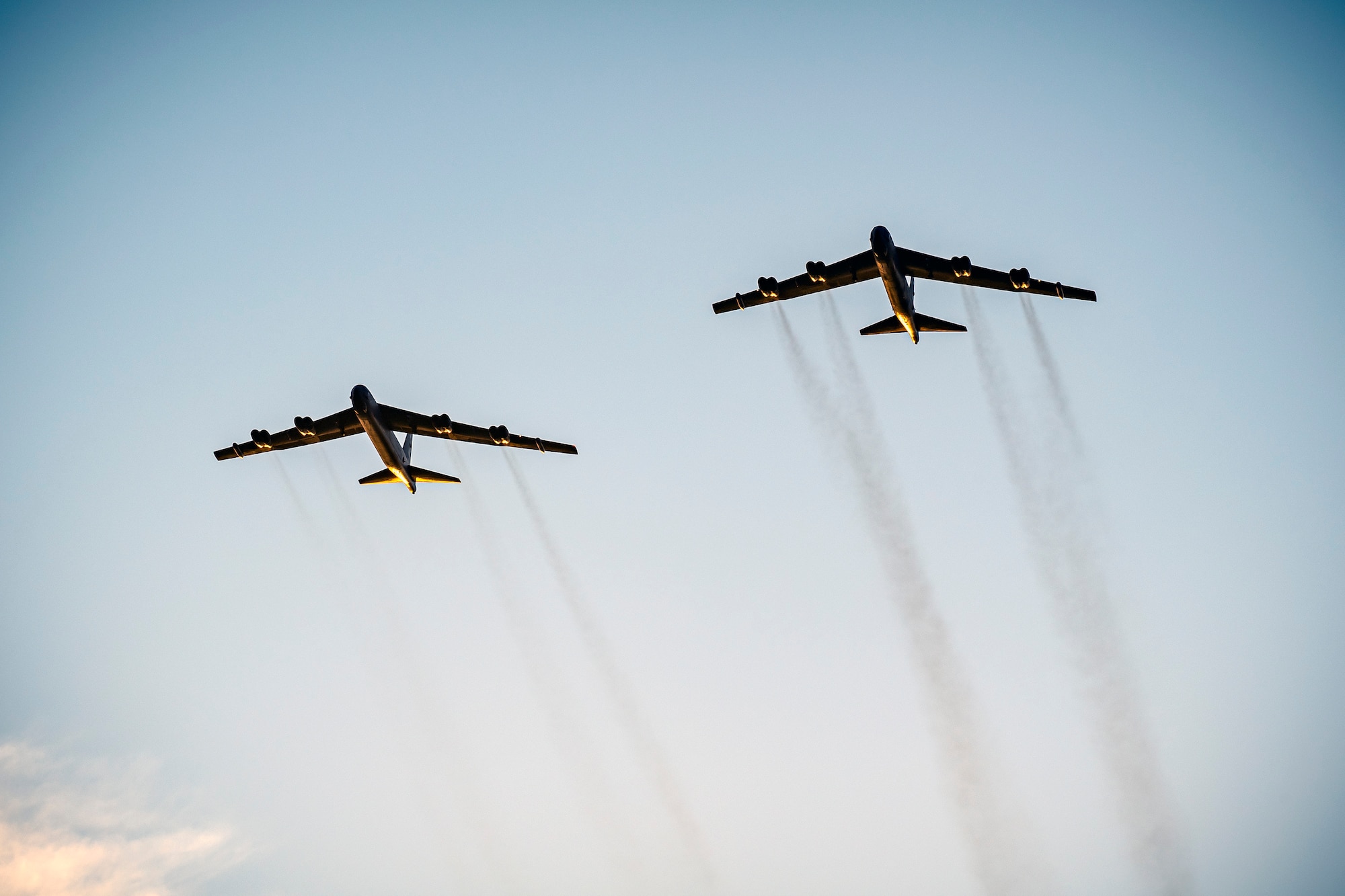 Two B-52 Stratofortressess fly overhead at RAF Fairford, England, Aug. 22, 2020. Strategic bomber missions enhance the readiness and training necessary to respond to any potential crisis or challenge across the globe. (U.S. Air Force photo by Senior Airman Eugene Oliver)