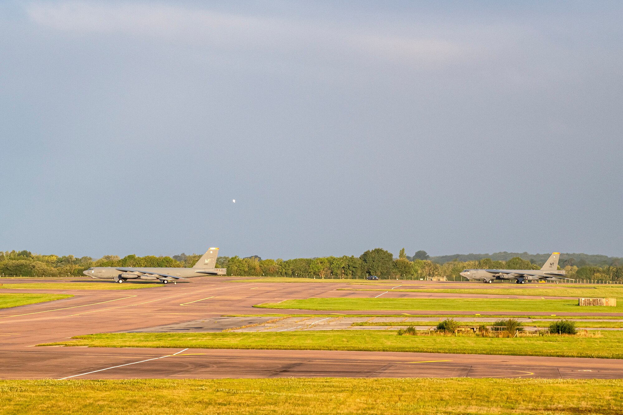 Two B-52 Stratofortressess taxi on the runway at RAF Fairford, England, Aug. 22, 2020. The Department of Defense maintains command and control of its bomber force for any mission, anywhere in the world at any time. (U.S. Air Force photo by Senior Airman Eugene Oliver)
