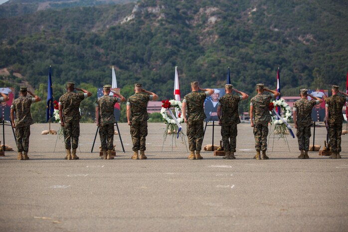U.S. Marines and Sailors render a salute during a memorial service at Marine Corps Base Camp Pendleton, California, Aug. 21.