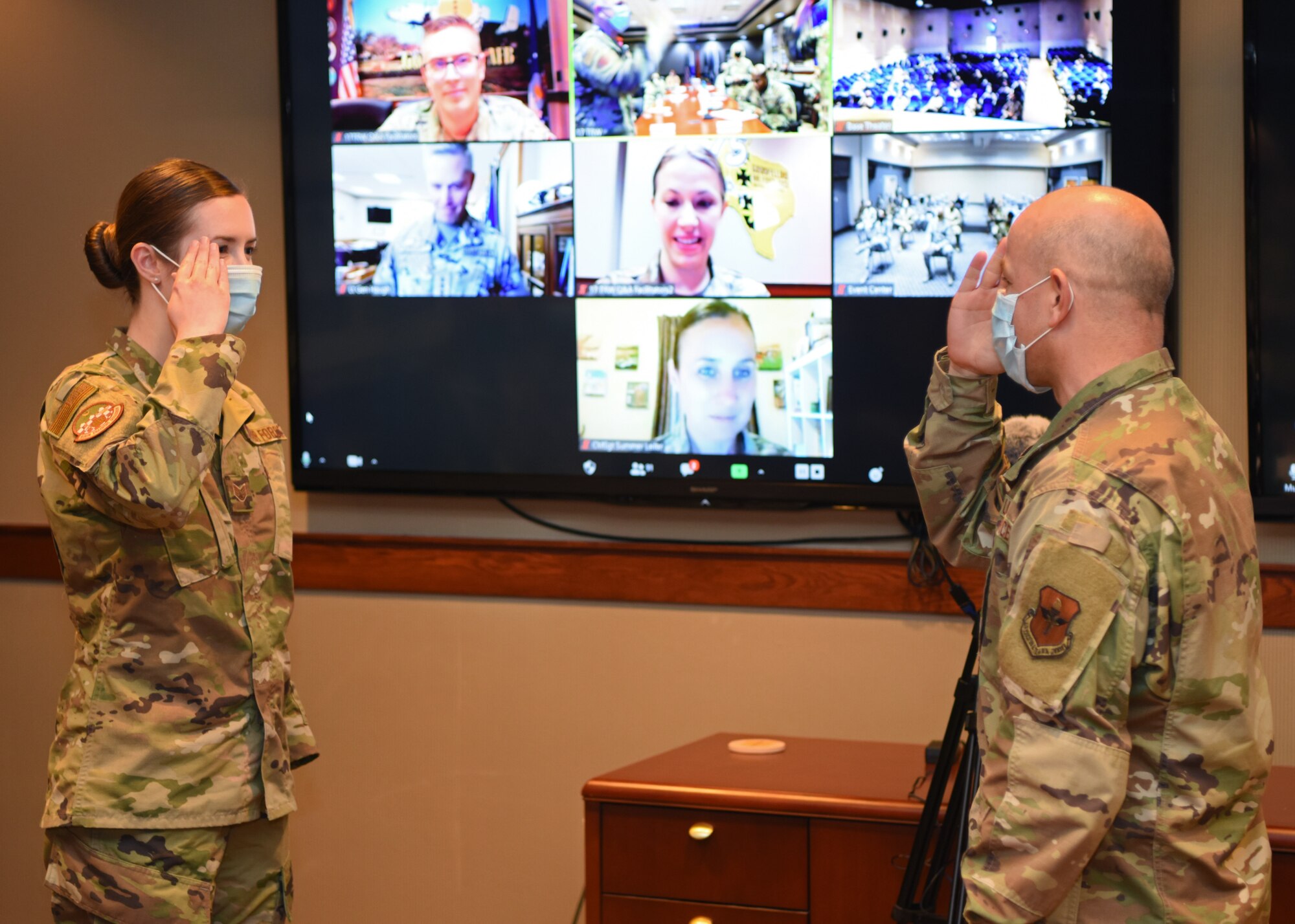 U.S. Air Force Col. Andres Nazario, 17th Training Wing, commander, salutes Staff Sgt. Ricky Adams, 315th Training Squadron instructor, on behalf of Lt. Gen. Timothy Haugh, 16 Air Force commander at Goodfellow Air Force Base, Texas, Aug. 17, 2020. Nazario presented coins on Haugh’s behalf to outstanding Airmen. (U.S. Air Force photo by Airman 1st Class Ethan Sherwood)