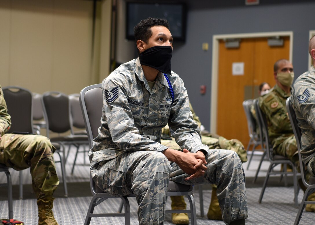 U.S. Air Force Tech. Sgt. Joseph Washington, 315th Training Squadron master military training leader, listens to Lt. Gen. Timothy Haugh, 16 Air Force commander, and Chief Master Sgt. Summer Leifer, 16 AF command chief, discuss the 16 AF’s intelligence community at Goodfellow Air Force Base, Texas, Aug. 17, 2020. Washington and other Airmen participated in a virtual information warfare all call. (U.S. Air Force photo by Airman 1st Class Ethan Sherwood)
