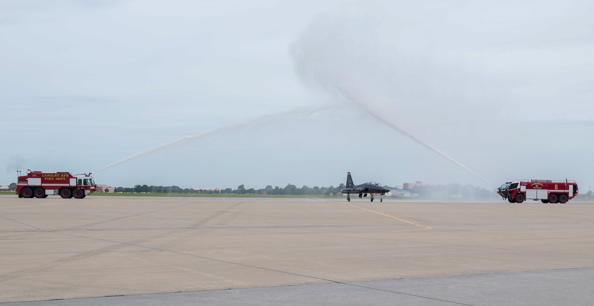 Aircraft going through water hoses