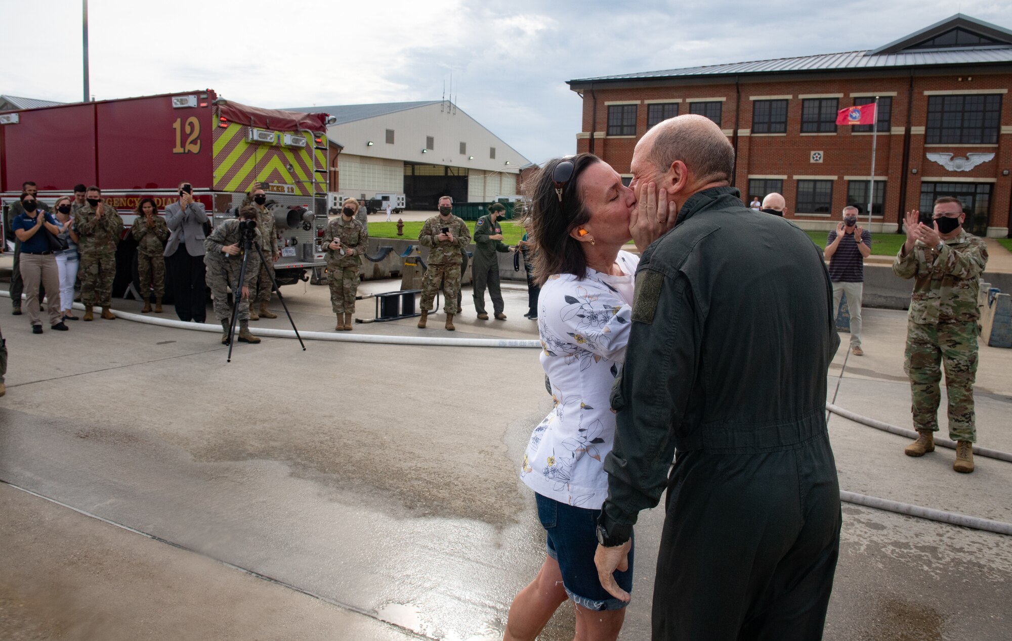 Sara Holmes kissing husband Gen. Holmes