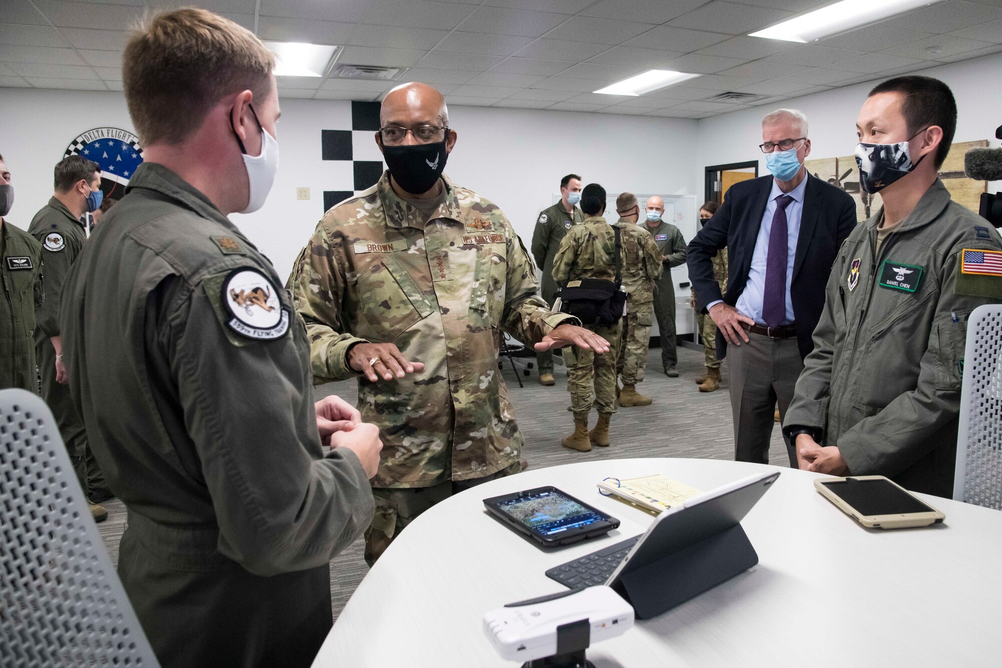 Chief of Staff of the Air Force Gen. Charles Q. Brown Jr. speaks with Maj. Michael Fleherty, 559th Flying Training Squadron instructor pilot, about the use of the electronic flight bag during a tour of Undergraduate Pilot Training 2.5 Aug. 20, 2020, at Joint Base San Antonio-Randolph, Texas. Brown, along with Secretary of the Air Force Barbara Barrett and Chief Master Sgt. JoAnne Bass, saw first-hand Air Education and Training Command’s efforts to modernize pilot training that will produce pilots able to meet 21st Century missions.