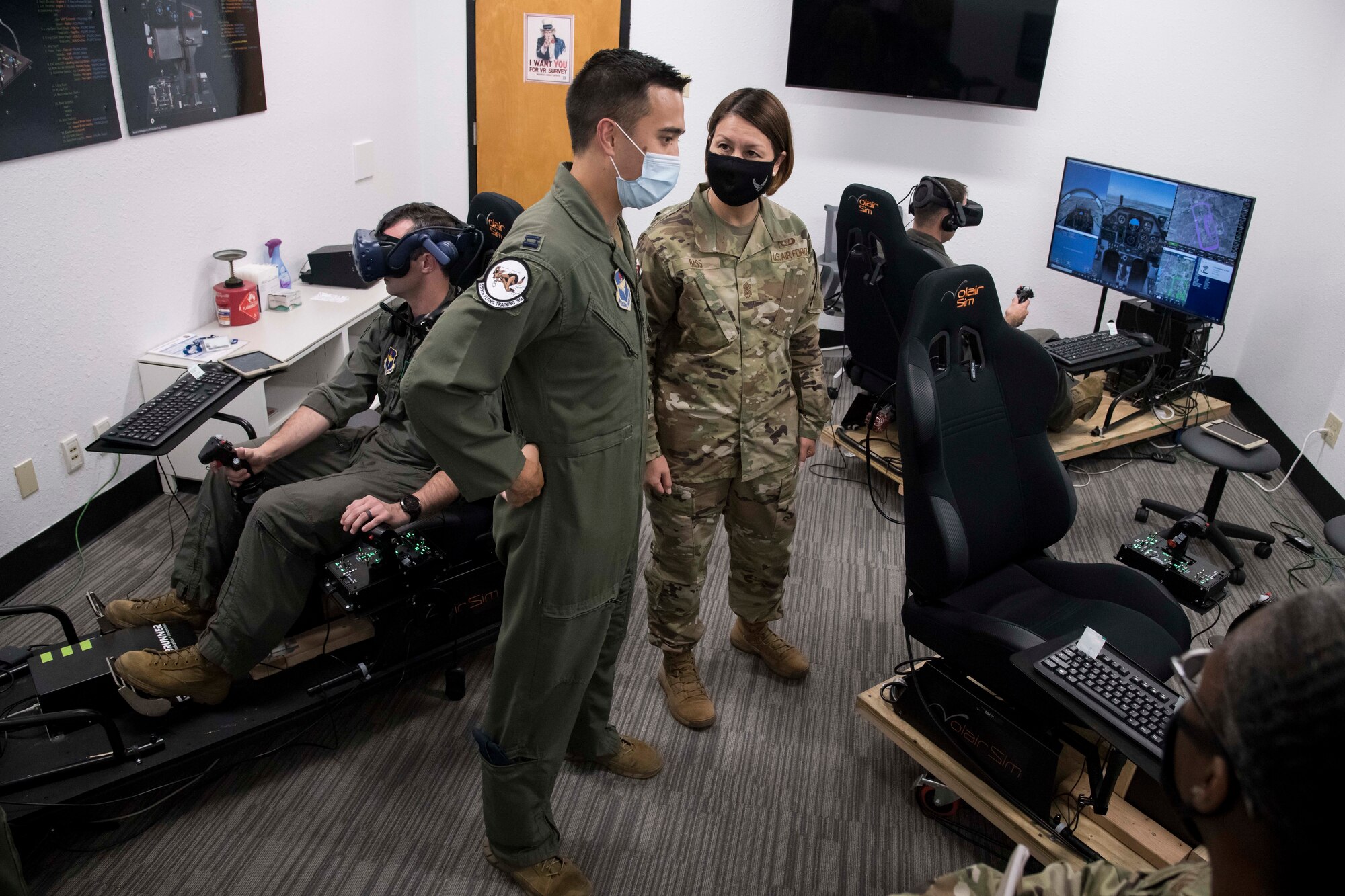 Chief Master Sgt. of the Air Force JoAnne S. Bass speaks with Capt. Orion Kellogg, 559th Flying Training Squadron instructor pilot, about the use of the virtual reality flight simulators for flying training during a tour of Undergraduate Pilot Training 2.5 Aug. 20, 2020, at Joint Base San Antonio-Randolph, Texas. Bass, along with Secretary of the Air Force Barbara Barrett and Chief of Staff of the Air Force Gen. Charles Q. Brown Jr., visited  Air Education and Training Command’s accelerated pilot training program that combines student-centered learning with integrated immersive technology, seamless access to content and quality instruction.