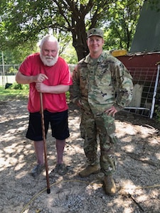 Spc. Clinton Fauss, right, a truck driver with 120th Forward Support Battalion, 120th Engineer Battalion, 90th Troop Command, Oklahoma Army National Guard, helped rescue Lee Harkin after his vehicle rolled into a ditch outside Tulsa, Oklahoma, Aug. 12, 2020.