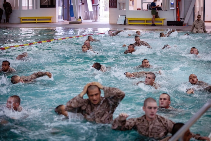 Recruits with Lima Company, 3rd Recruit Training Battalion, participate in the Water Survival Basic Qualification course at Marine Corps Recruit Depot San Diego, Aug. 17, 2020.