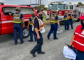 Members of the Edwards AFB Fire & Emergency Services and 412th Security Forces Squadron react during an active-shooter exercise at Edwards Air Force Base, California, Aug. 12 and 13. The two services employed the Rescue Task Force concept which aims to bring a quicker response time for victims.  (Air Force photo by Tech. Sgt. Felix Colon)