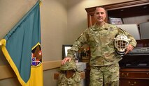 Col. Brian C. Bolio, commander, 1st Space Brigade, U.S. Army Space and Missile Defense Command, poses with his "battle rattle" in his office at Fort Carson, Colorado. Bolio recently took command of the brigade. (U.S. Army photo by Staff Sgt. Aaron Rognstad/RELEASED)