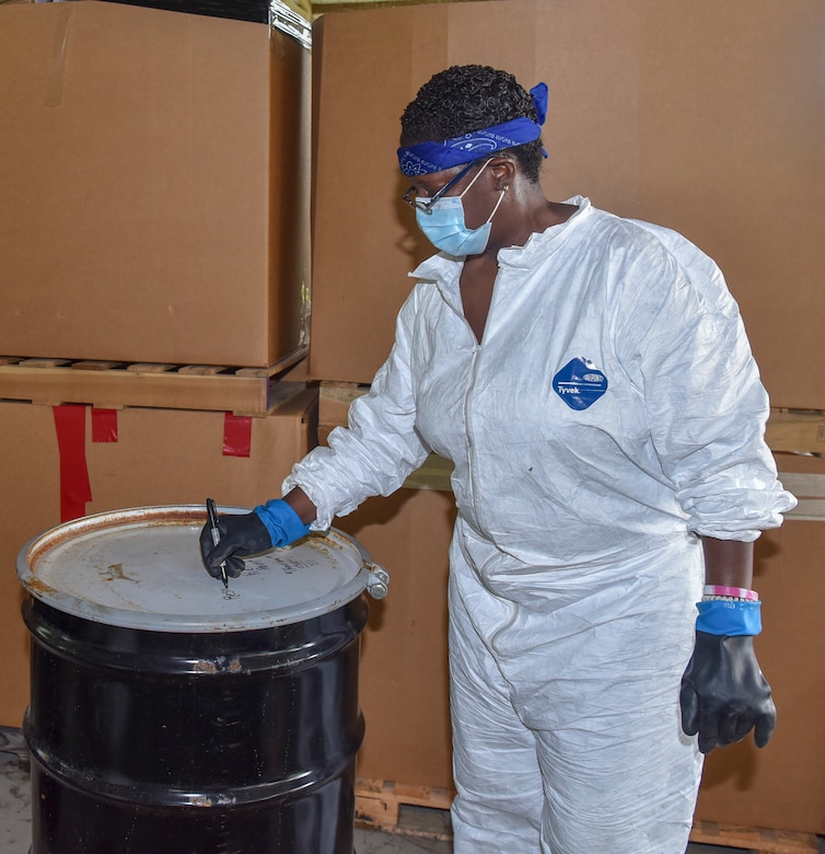 Marsha K. Singleton, an environmental protection specialist assigned to the 628th Civil Engineer Squadron Installation Management Flight Environmental Management Element, labels a barrel in preparation for it to be properly disposed of at Joint Base Charleston, S.C., July 31, 2020. Members of the 628th CES Installation Management Flight Environmental Management Element receive hazardous waste from different areas of Joint Base Charleston. Their mission is to dispose of the waste properly to keep the environment and the local community safe.