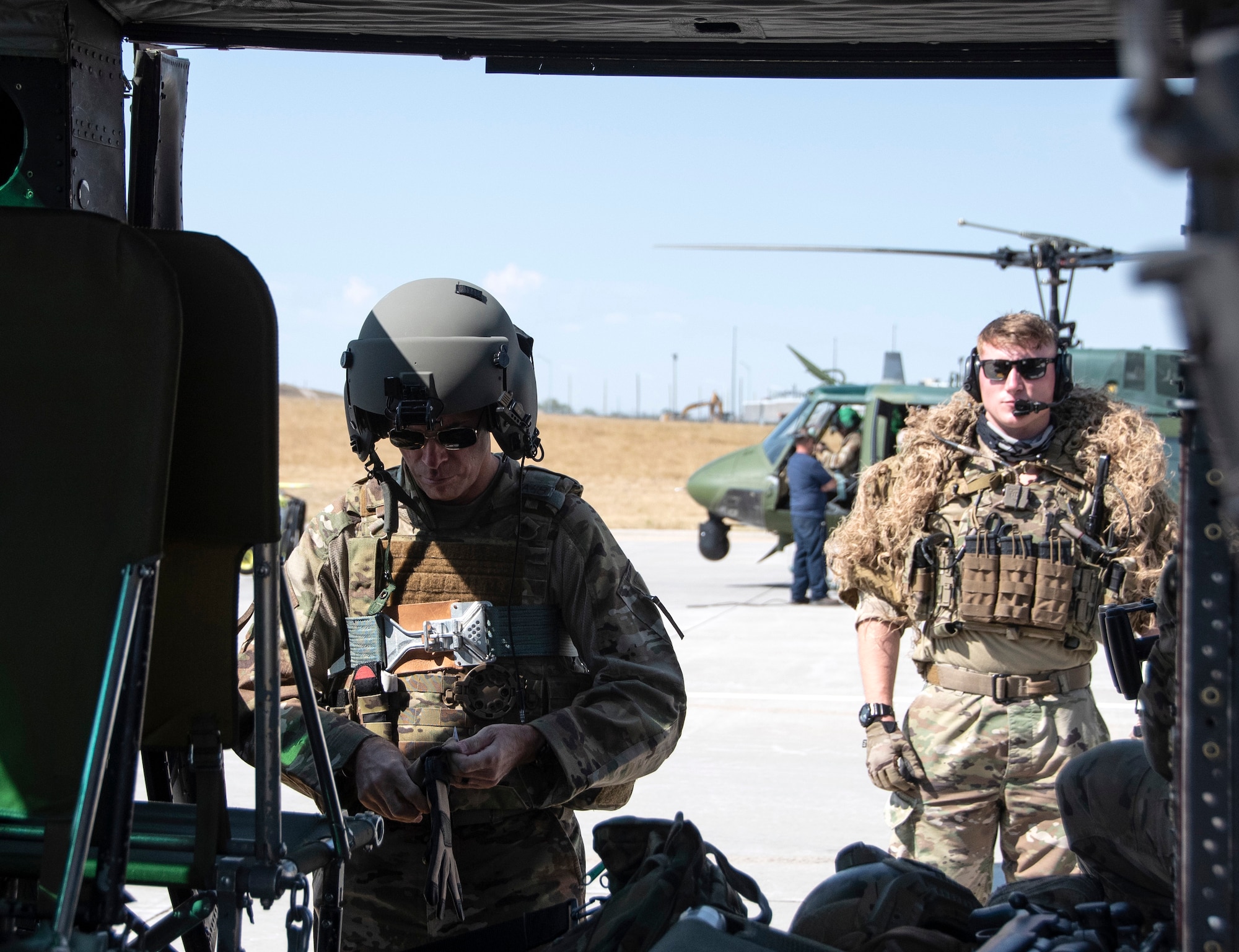 Airmen gear up to board a UH-1N helicopter