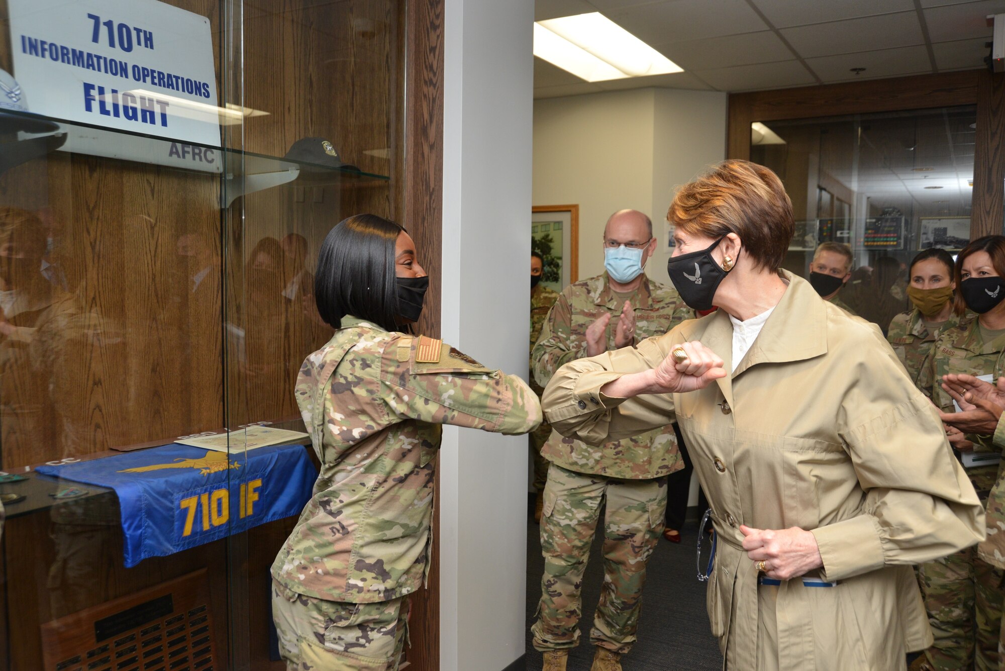 ecretary of the Air Force Barbara M. Barrett gives an elbow bump to Staff Sgt. Elikplim Seddoh from Sixteenth Air Force