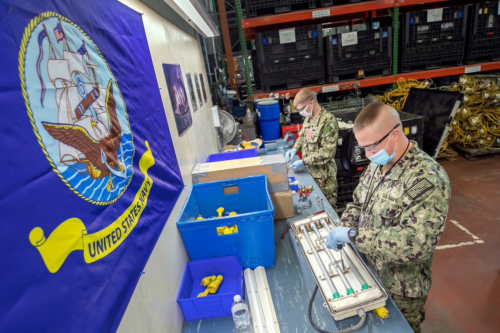 SurgeMain Reservists recycle LED light fixtures while working  at Puget Sound Naval Shipyard & Intermediate Maintenance Facility in Bremerton, Washington.