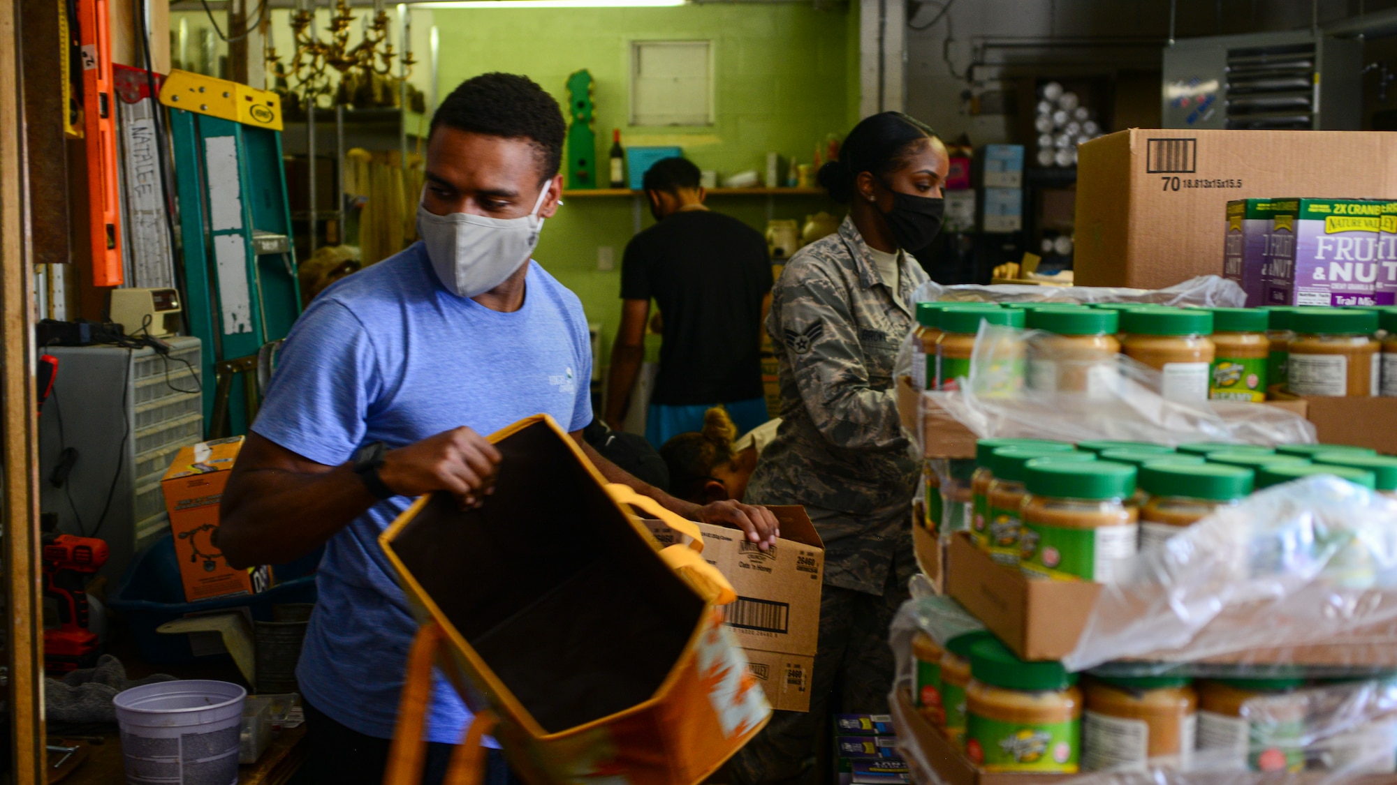 SrA Monzell Wiggins sorts through donations