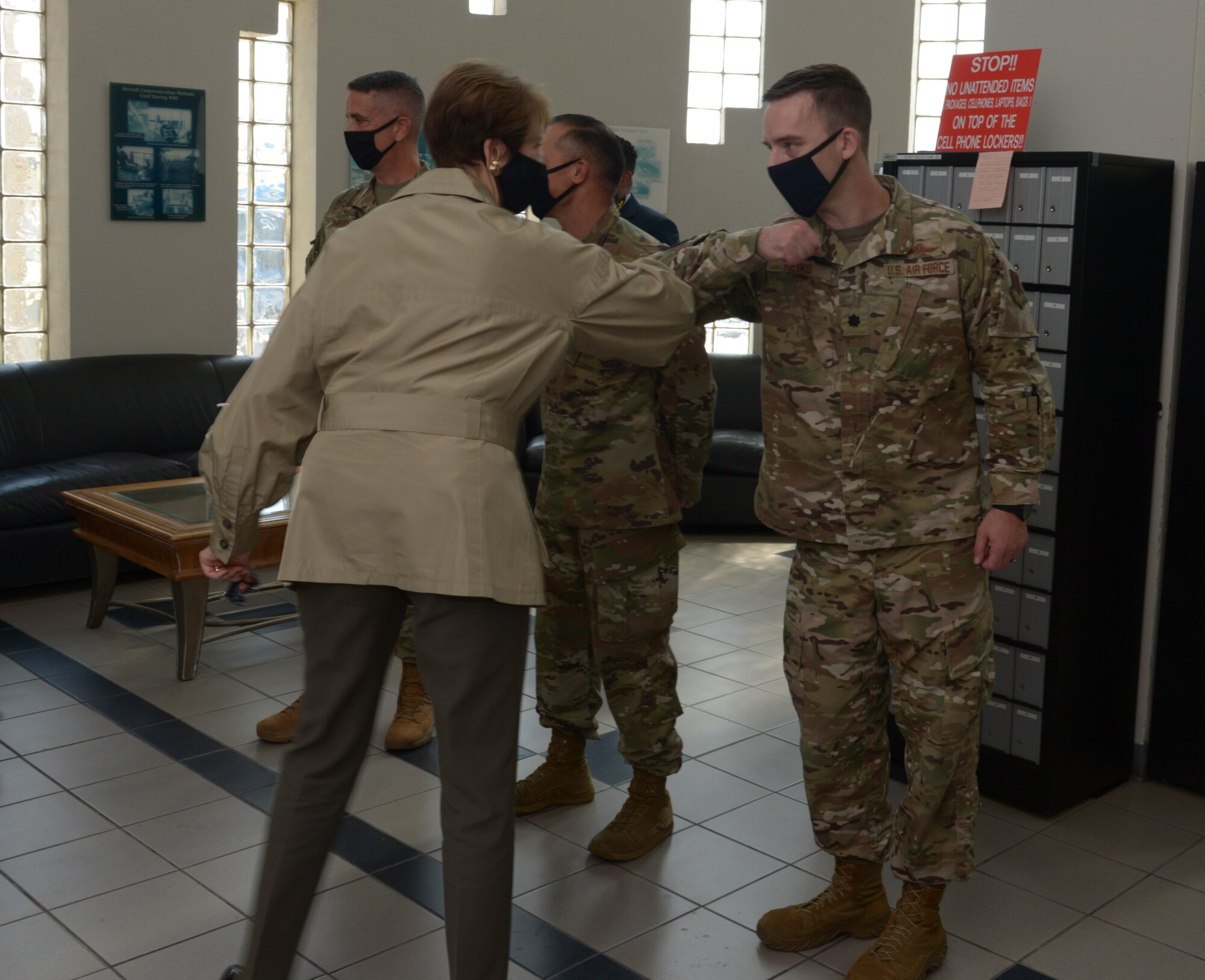 Lt. Col. John Heins, 91st Cyberspace Operations Squadron commander bumps elbows in greeting with SecAF Barbara M. Barrett