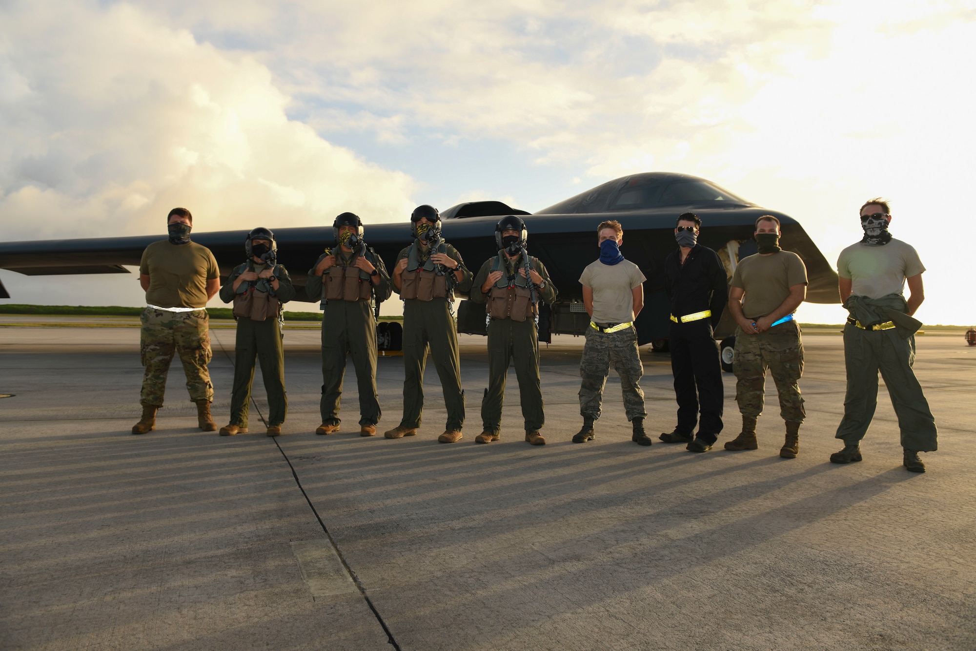 U.S. Air Force B-2 Spirit Stealth Bomber pilots and maintainers assigned to the 393rd Expeditionary Bomb Squadron, deployed from Whiteman Air Force Base, Missouri, pose for a photo after a flying mission at Naval Support Facility Diego Garcia, to support a Bomber Task Force mission,  Aug. 17, 2020. U.S. Strategic Command units regularly conduct training with U.S. Indo-Pacific Command to ensure a free and open Indo-Pacific. USSTRATCOM Bomber Task Force missions help maintain global stability and security while enabling units to become familiar with operations in different regions.(U.S. Air Force photo by Tech. Sgt. Heather Salazar)