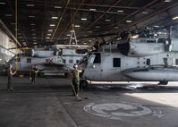 Marines with Marine Heavy Helicopter Squadron 366 perform maintenance on a CH-53E Super Stallion before Exercise Deep Water 2020 at Marine Corps Air Station New River, North Carolina, July 29, 2020. The purpose of the exercise is to increase 2nd Marine Aircraft Wing’s interoperability and readiness on a scale that simulates peer-level threats. (U.S. Marine Corps photo by Lance Cpl. Yuritzy Gomez)