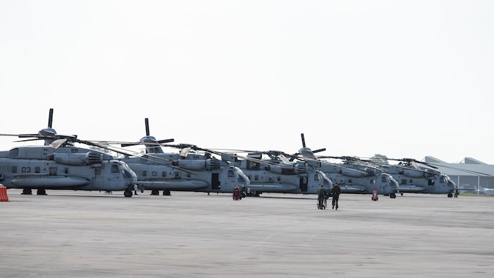 CH-53E Super Stallions with Marine Heavy Helicopter Squadron 366 sit on the flight line before conducting Exercise Deep Water 2020 at Marine Corps Air Station New River, North Carolina, July 29, 2020. The purpose of the exercise is to increase 2nd Marine Aircraft Wing’s interoperability and readiness on a scale that simulates peer-level threats. (U.S. Marine Corps photo by Lance Cpl. Yuritzy Gomez)