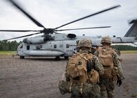 Marines with 3rd Battalion, 6th Marines, board a CH-53E Super Stallion with Marine Heavy Helicopter Squadron 366 during Exercise Deep Water 2020 at Marine Corps Air Station New River, North Carolina, July 29, 2020. The purpose of the exercise is to increase 2nd Marine Aircraft Wing’s interoperability and readiness on a scale that simulates peer-level threats. (U.S. Marine Corps photo by Lance Cpl. Yuritzy Gomez)