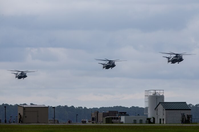 CH-53E Super Stallions with Marine Heavy Helicopter Squadron 366 and HMH-461 prepare to land during Exercise Deep Water 2020 at Marine Corps Air Station New River, North Carolina, July 29, 2020. The purpose of the exercise is to increase 2nd Marine Aircraft Wing’s interoperability and readiness on a scale that simulates peer-level threats. (U.S. Marine Corps photo by Lance Cpl. Elias E. Pimentel III)