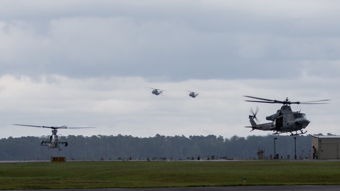 A UH-1Y Huey, AH-1Z Viper, and CH-53E Super Stallions with Marine Light Attack Helicopter Squadron 167 and Marine Heavy Helicopter Squadron 464 prepare to land during Exercise Deep Water 2020 at Marine Corps Air Station New River, North Carolina, July 29, 2020. The purpose of the exercise is to increase 2nd Marine Aircraft Wing’s interoperability and readiness on a scale that simulates peer-level threats. (U.S. Marine Corps photo by Lance Cpl. Elias E. Pimentel III)
