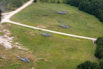 U.S. Marine Corps CH-53E Super Stallions with Marine Heavy Helicopter Squadron 366 drop off Marines on a landing zone during Exercise Deep Water 2020 at Marine Corps Air Station New River, North Carolina, July 29, 2020. The purpose of the exercise is to increase 2nd Marine Aircraft Wing's interoperability and readiness on a scale that simulates peer-level threats. (U.S Marine Corps Photo by Cpl. Juan C. Dominguez)