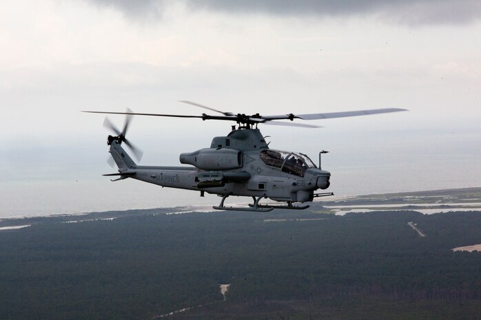 A U.S. Marine Corps AH-1Z Viper with Marine Light Attack Helicopter Squadron 269 conducts reconnaissance and surveillance, during Exercise Deep Water 2020, above Marine Corps Air Station New River, North Carolina, July 29, 2020. The purpose of the exercise is to increase 2nd Marine Aircraft Wing's interoperability and readiness on a scale that simulates peer-level threats. (U.S Marine Corps Photo by Cpl. Juan C. Dominguez)