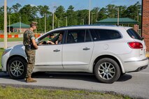 U.S. Marine Corps Lance Cpl. Samuel Spearman, a military police officer with Headquarters and Support Battalion, Marine Corps Installations East-Marine Corps Base Camp Lejeune, conducts felony traffic training as part of the Field Training Officer program at the main gate on Marine Corps Air Station New River, North Carolina July 31, 2020. MCAS New River has introduced the Field Training Officer program in order to ensure that military police officers are trained to be more proficient and skillful at their duties. (U.S. Marine Corps Photo by Lance Cpl. Isaiah Gomez)